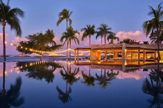 Pool and palm trees in Punta de Mita