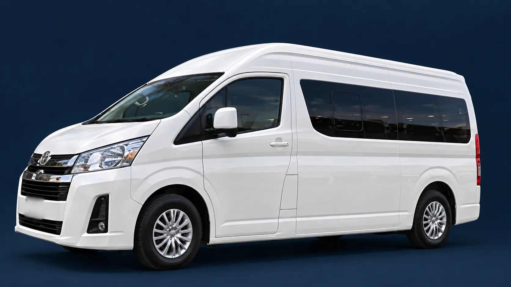 White Toyota Hiace passenger van
